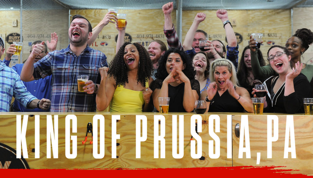 Bury The Hatchet King of Prussia PA City Page Header Image. Axe throwers celebrating with hands in air