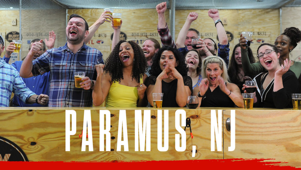 Bury The Hatchet Paramus NJ City Page Header Image. Axe throwers celebrating with hands in air